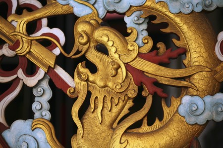 Sculpture of dragon on wallの写真素材