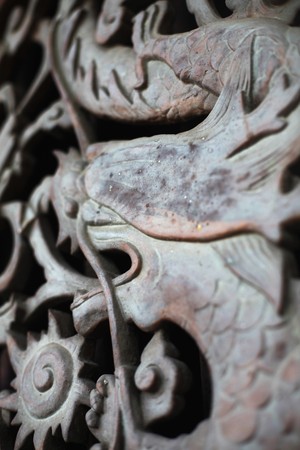 Sculpture of dragon on wallの写真素材