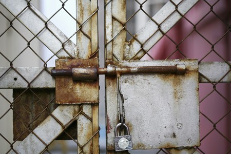 Chain link fence with padlockの写真素材