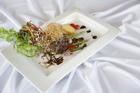 Roasted beef with sliced potatoes and asparagusの写真素材