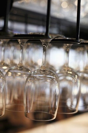Rows of hanging wine glassesの写真素材