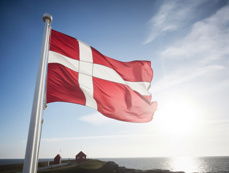 The Danish flag, the Dannebrog, waves in the wind.の素材