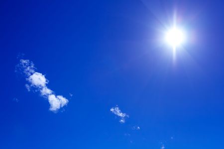 sun and beautiful clouds on blue sky