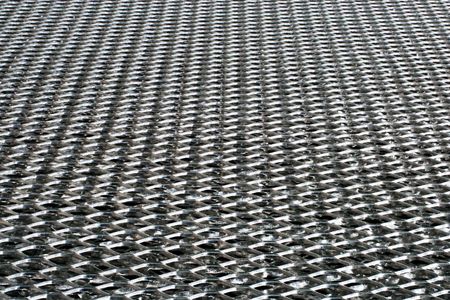 Texture of industrial metal perforated sheetの写真素材
