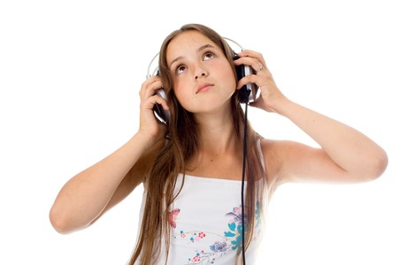 Dancing girl with headphones listen music. Isolated on white.の写真素材