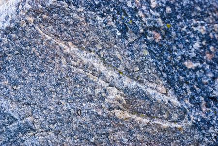 Fragment of granite rock. Moss wisible. の写真素材