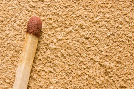 One safety match (extremely close-up). Leather backgroundの写真素材