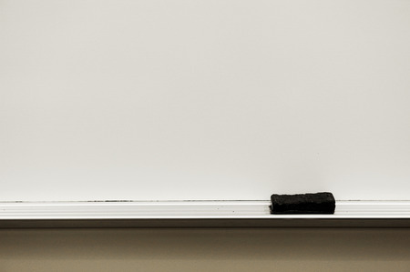 close up on white board eraser and board in classroom