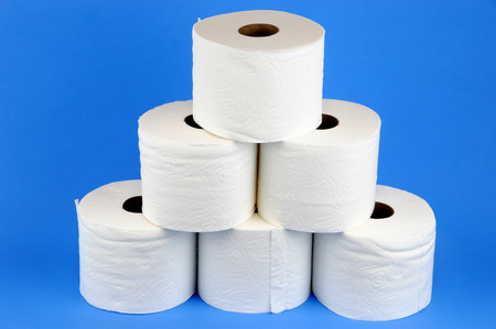 toilet paper rolls on blue backgroundの写真素材