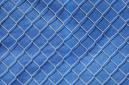 iron fence and plastic net in construction siteの写真素材