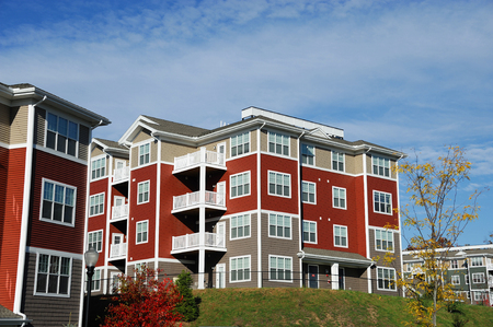 Close up on modern apartment building with blue skyの写真素材