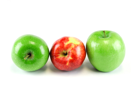 green and red apples on white backgroundの写真素材