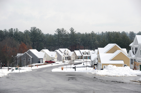 houses in residential community after snow in winterの写真素材