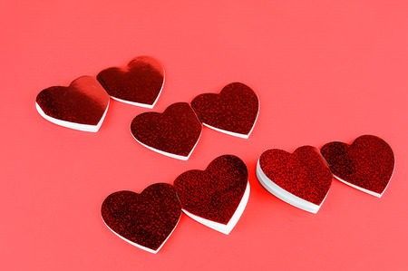 heart shape note pad on red backgroundの写真素材