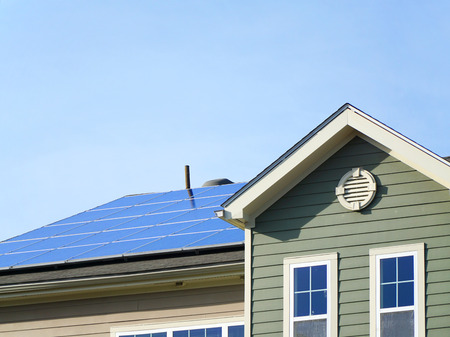solar panel on the roof of apartment buildingの写真素材