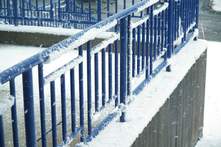 close up on outdoor rail in snowの写真素材