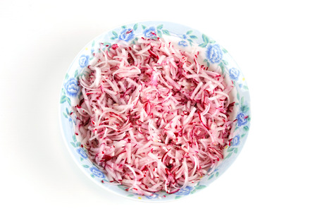 fresh chopped radish salad in the plateの写真素材