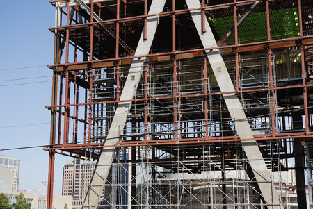 close up on modern building construction with construction frames