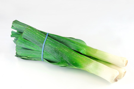 a bunch of fresh leek isolated on white background