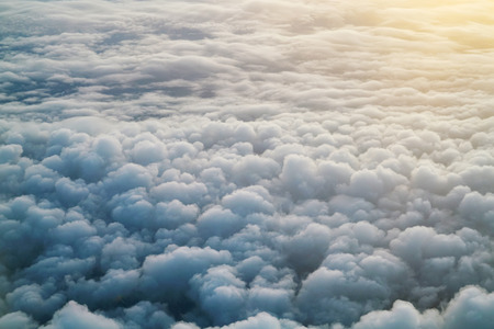 Aerial view of clouds background from airplaneの写真素材