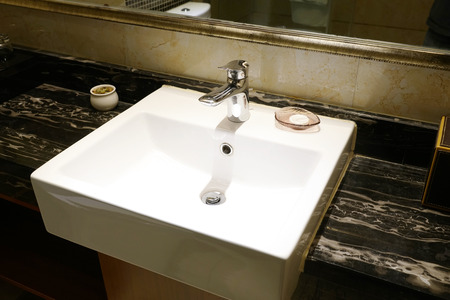 Water sink and faucet in bathroomの写真素材