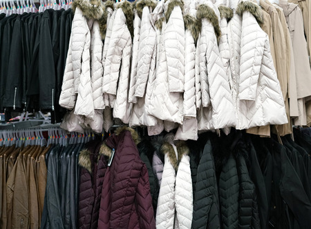 Hanging winter clothes in the storeの写真素材