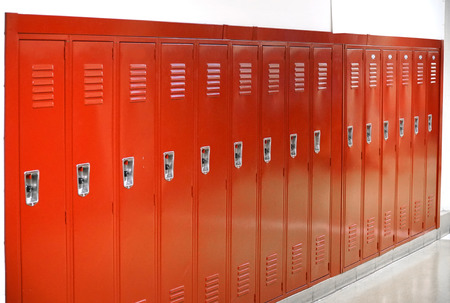 close up on red lockers in gym