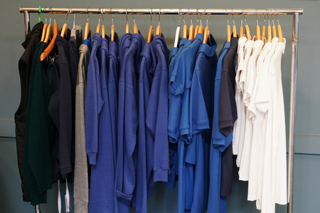 Close up on clothes hanging on the rackの写真素材