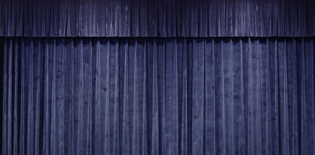 Close up on Blue curtain stage backgroundの写真素材