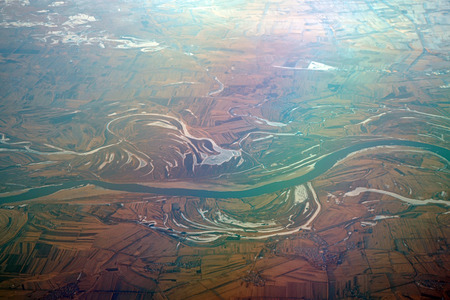 Aerial view of river winding in the mountain in winter