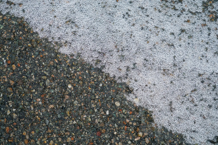 Ice on the road surface during frozen rain in winterの写真素材
