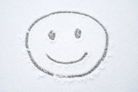 Smile face on the snow in winter after snowの写真素材
