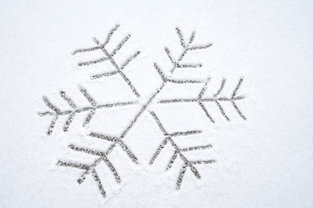Snowflake drawing on the snow