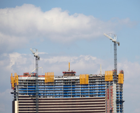 building construction site with construction frame and craneの写真素材
