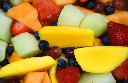 Close up on mixed fruit salad as food backgroundの写真素材