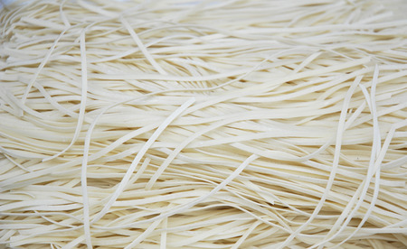 close up on raw noodles as food backgroundの写真素材