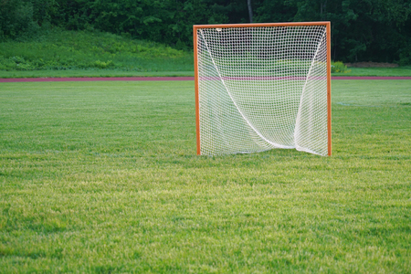 Close up on football goal on the grass fieldの写真素材