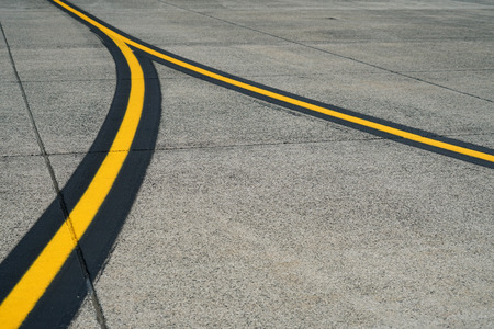 curved yellow line on the road