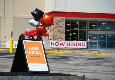 hiring notice on message board outside the storeの写真素材