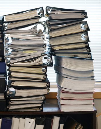 close up on the stacking documents and folders