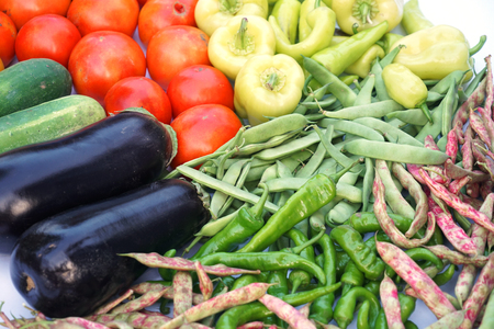 fresh farm picked vegetables isolated on white backgroundの写真素材
