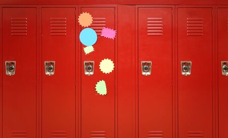 Colorful stickers on red lockers in the school
