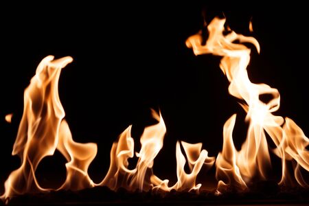 burning fire flame on the black backgroundの写真素材