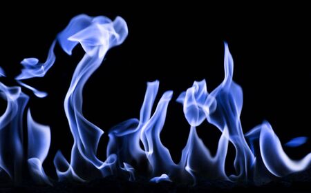 burning blue fire flame on the black backgroundの写真素材
