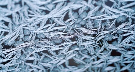 frost crystal on window glass in winter season