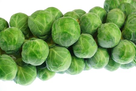 green Brussels sprout on the stem isolated on white backgroundの写真素材