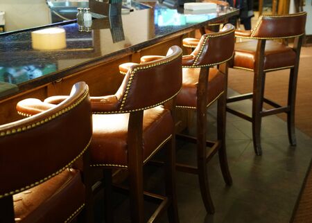 chairs in a row in the barの写真素材