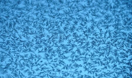 frost crystal on window glass in winter season
