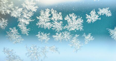 frost crystal on window glass in winter season
