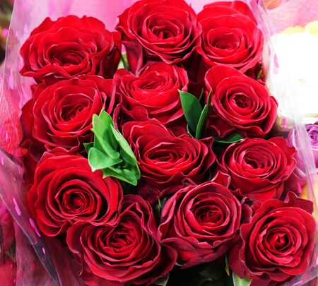 close up on packed red rose bouquet for holidayの写真素材